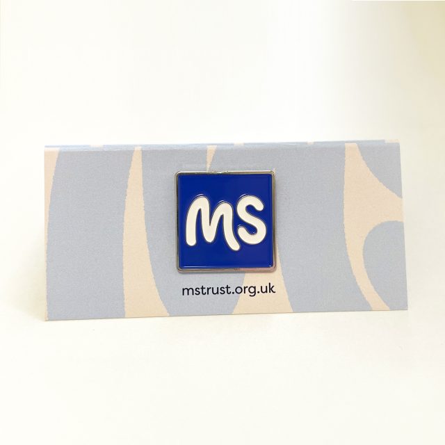 MS Trust's wedding favour - a blue square embossed with a white MS.